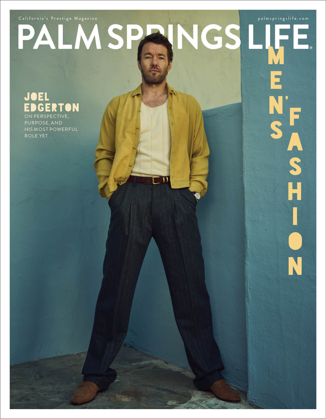 Palm Springs Life magazine cover featuring man and woman relaxing on midcentury hotel balconies overlooking pool and mountains